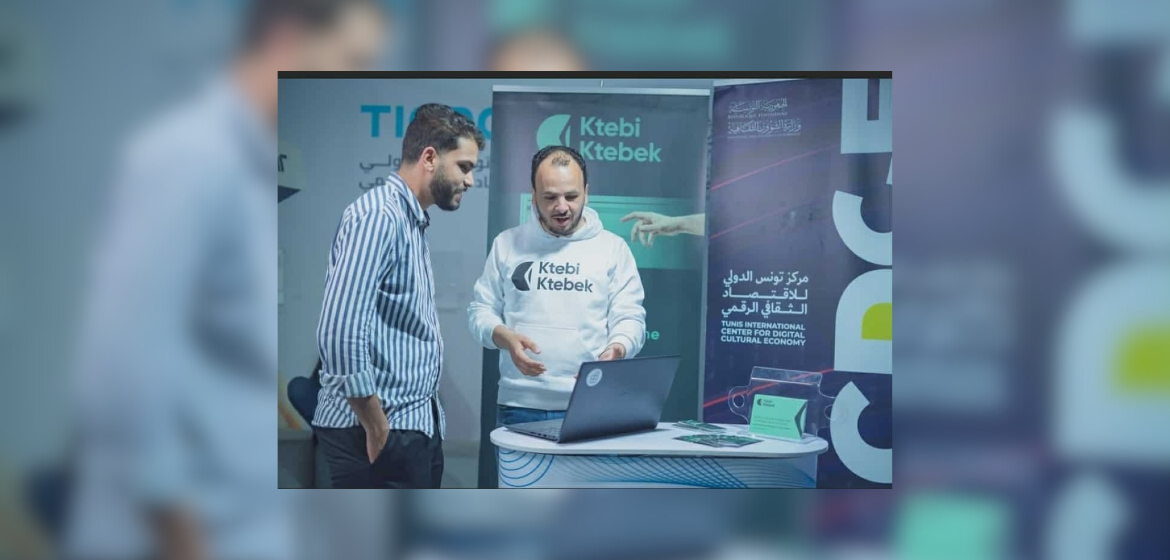 Mohamed Boumaiza at the Tunisian book fair 2025 talking to a customer. Photo: private.
