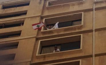 In action - Amir, one of the organizers of the YouStink-movement, waving the Lebanese flag. Photo: Private.