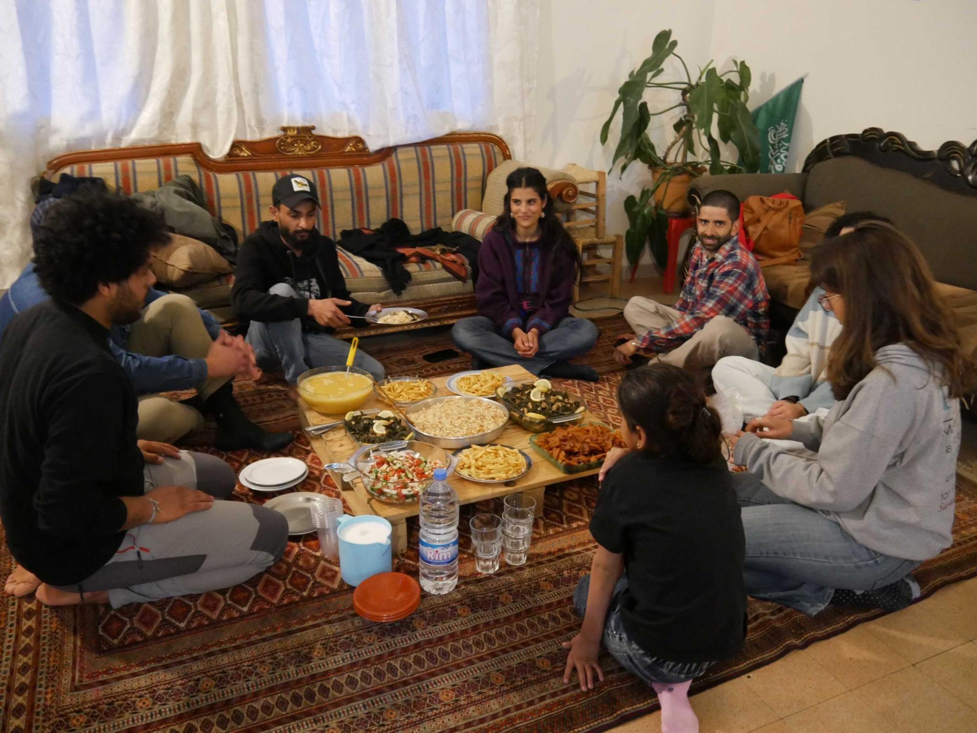 Family and friends sit around the table in the district of Mar Mickhael. Photo: Elena Athina Mieslinger (Instagram: @elena_athina)